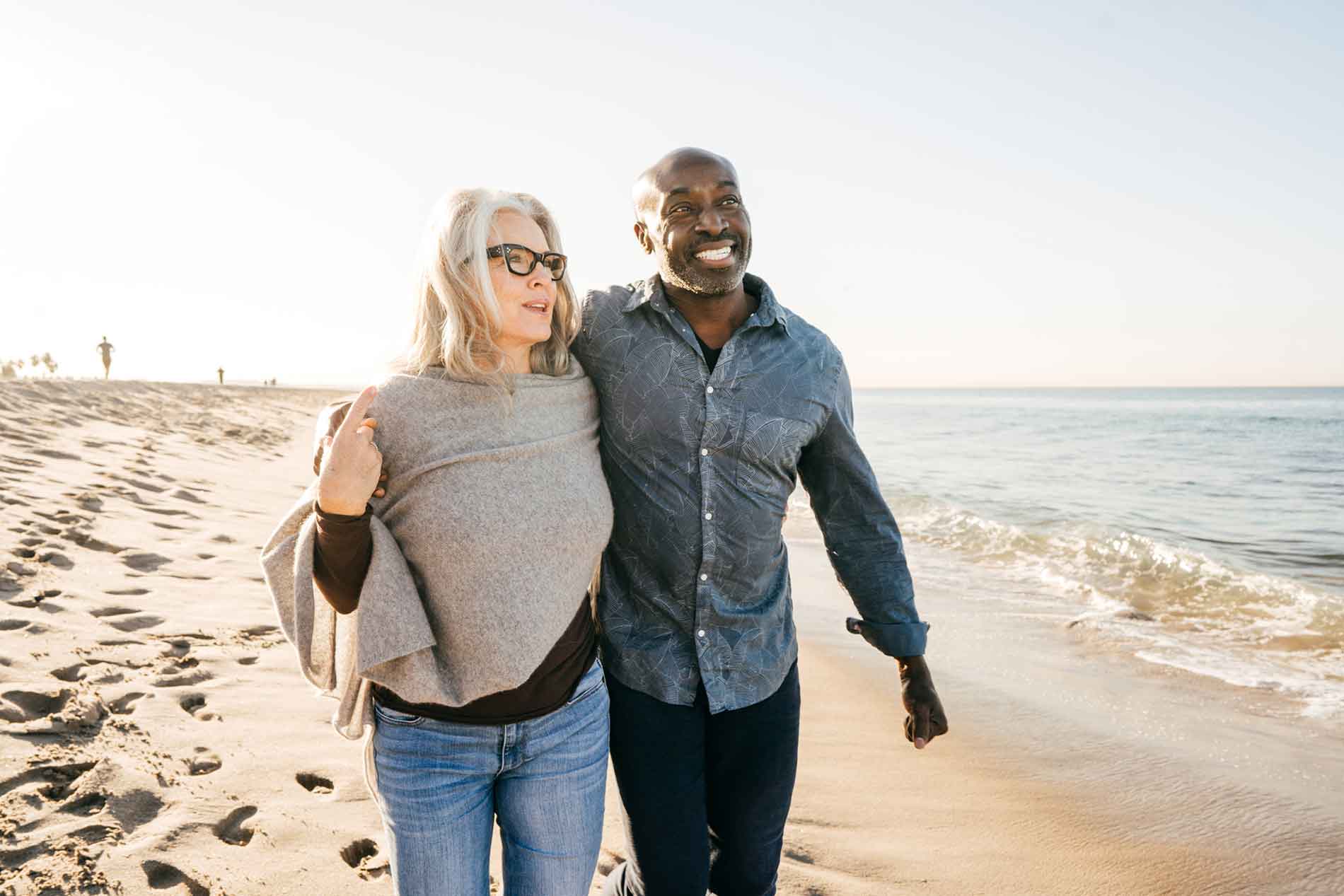 Couple walking along the beach