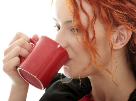 Satisfied woman drinking coffee